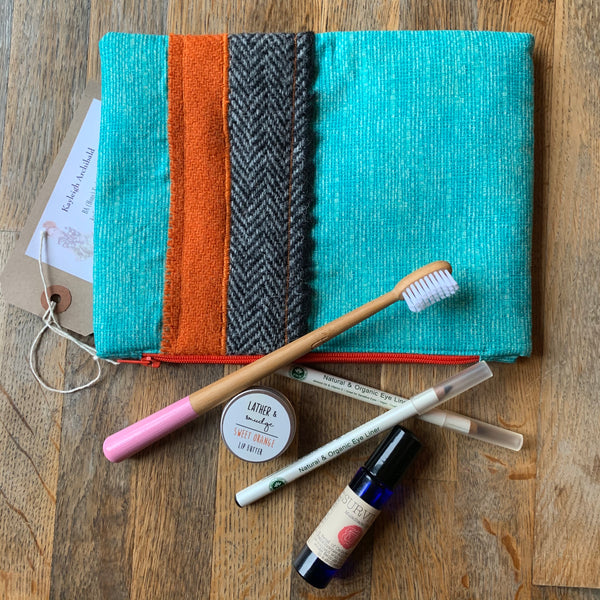 Hand sewn cosmetics and toiletry clutch bag