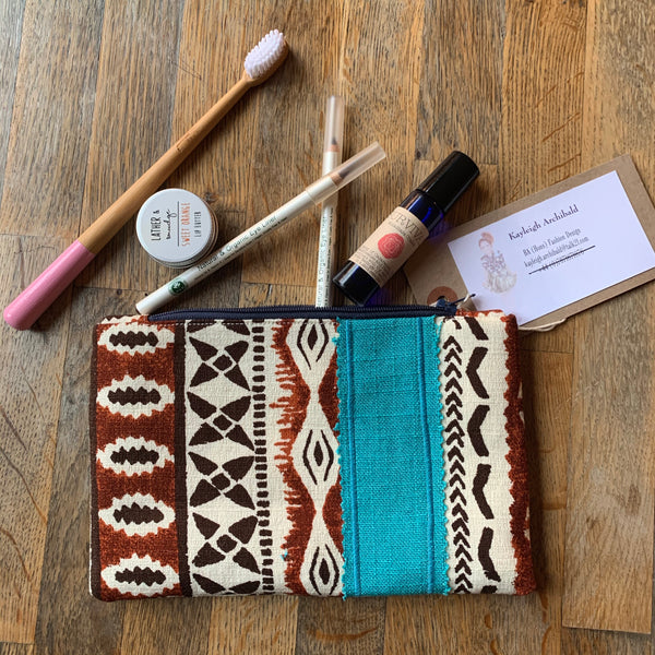 Hand sewn cosmetics and toiletry clutch bag